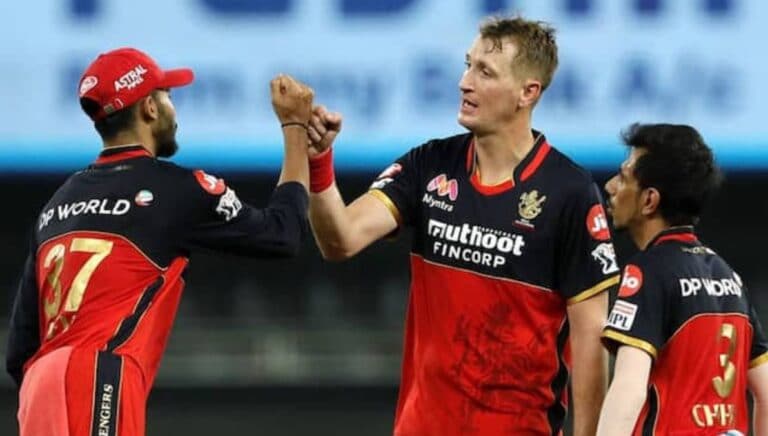 Why did RCB release Chris Morris and who can replace him?